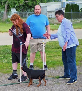 4-h'er with leaders and small dog